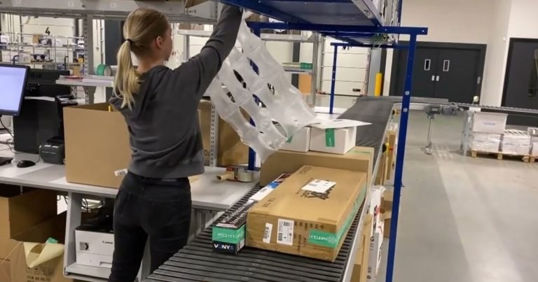 Logistics manager improving efficiency with protective packaging